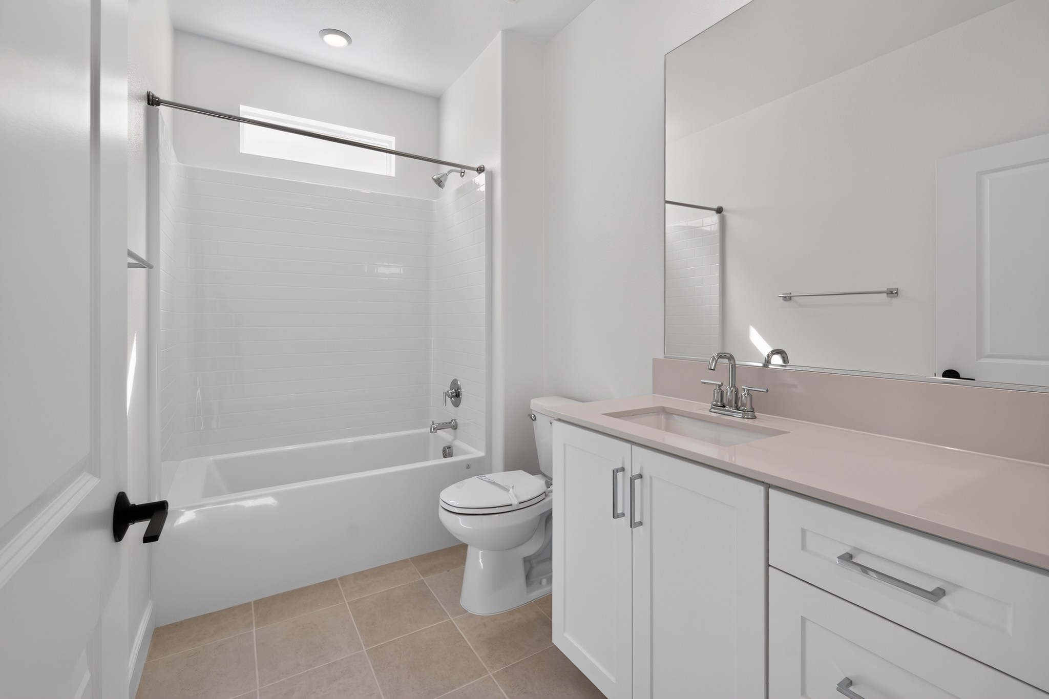 Finished bathroom with tub, vanity, and clean white finishes — budget refresh example in New Jersey