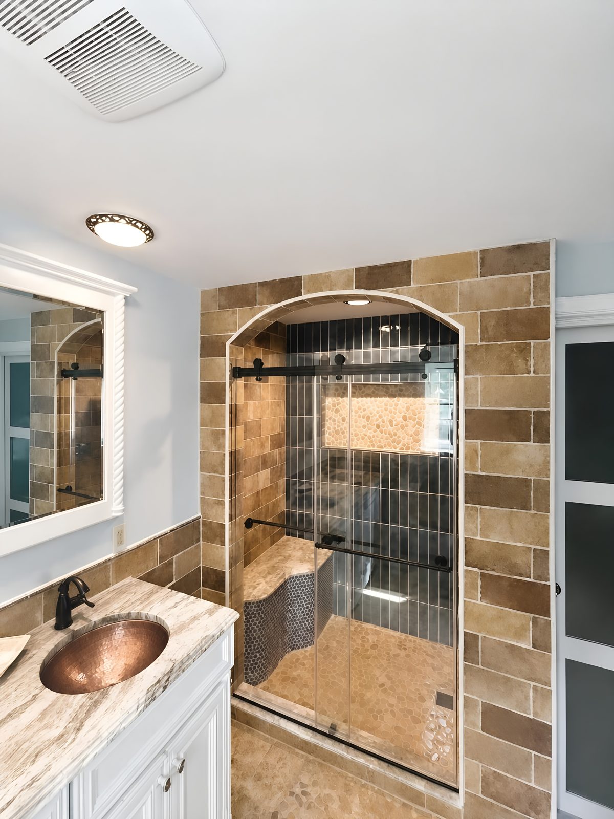 Wide view of the finished Galloway, NJ bathroom showing the arched shower entry and vanity